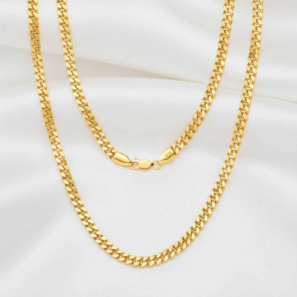 A double-strand yellow gold chain necklace with a curb link design and a lobster clasp, displayed against a solid white background.