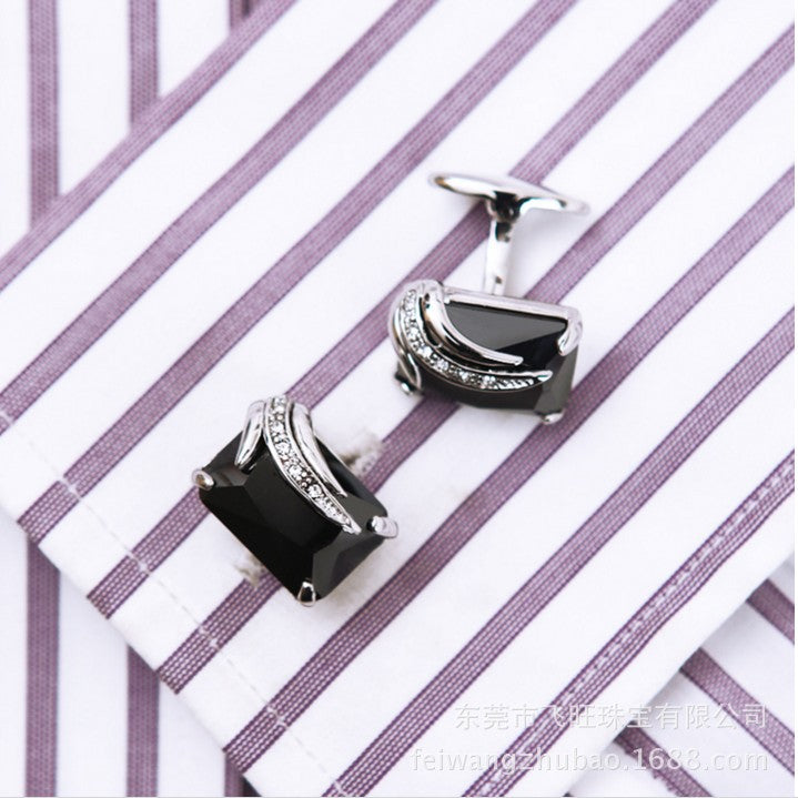 cufflinks on striped background