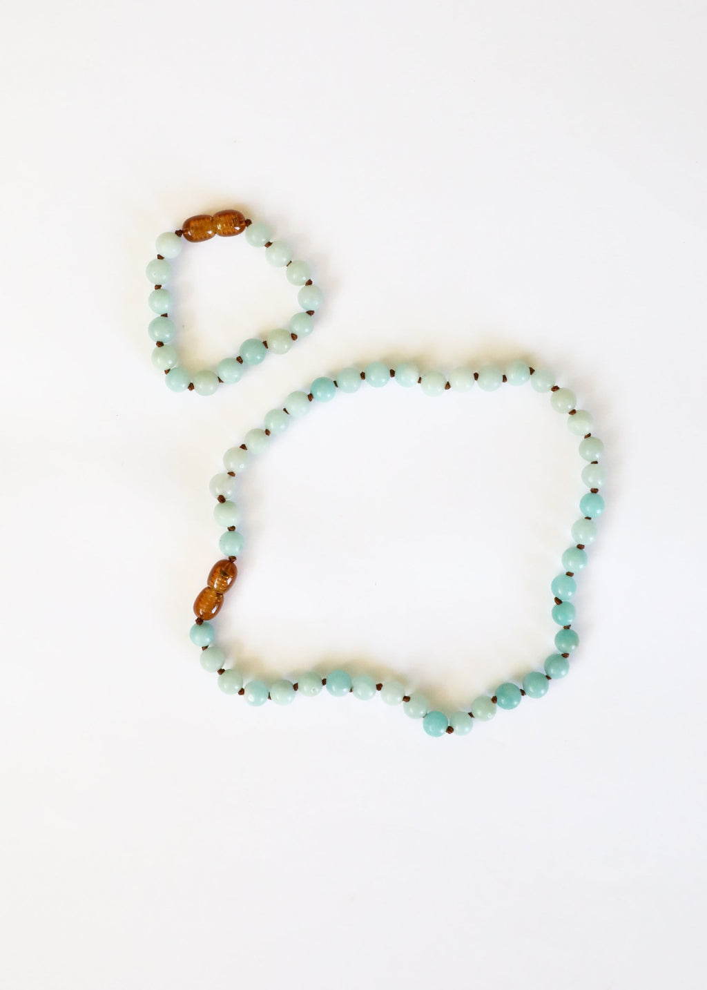 Two beaded bracelets on a white background