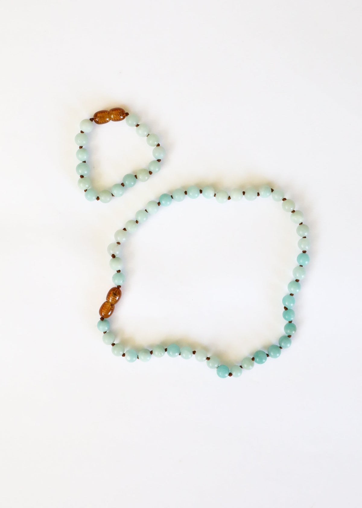 Two beaded bracelets on a white background