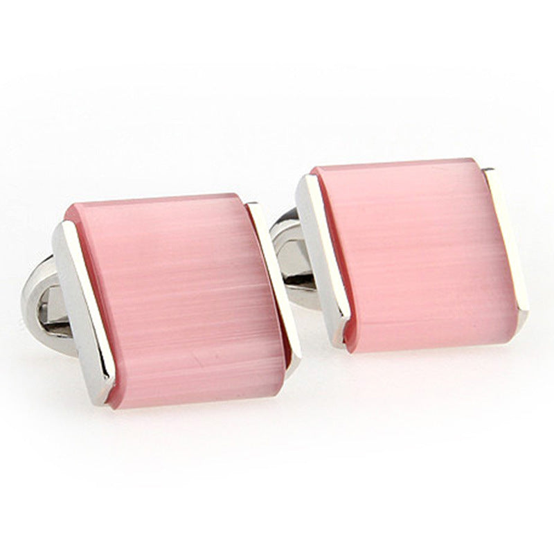 pink cufflinks white background