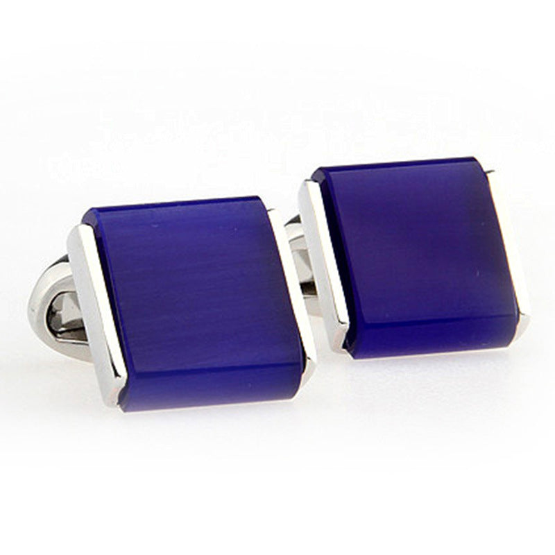 blue cufflinks white background