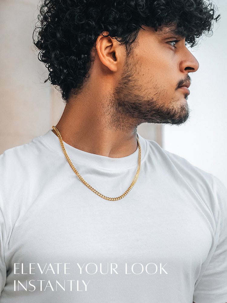 Man wearing a gold chain with text 'Elevate Your Look Instantly' on a neutral background