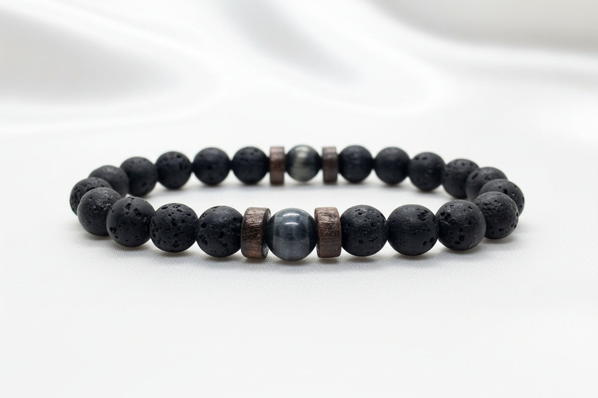 Black beaded bracelet with brown accents on a white background