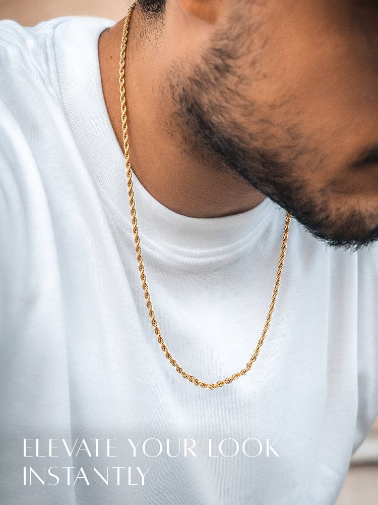 Man wearing a gold chain necklace with text 'Elevate Your Look Instantly' on a white background