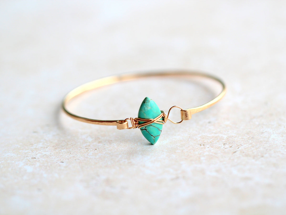turquoise stone gold wire bra elete on white background