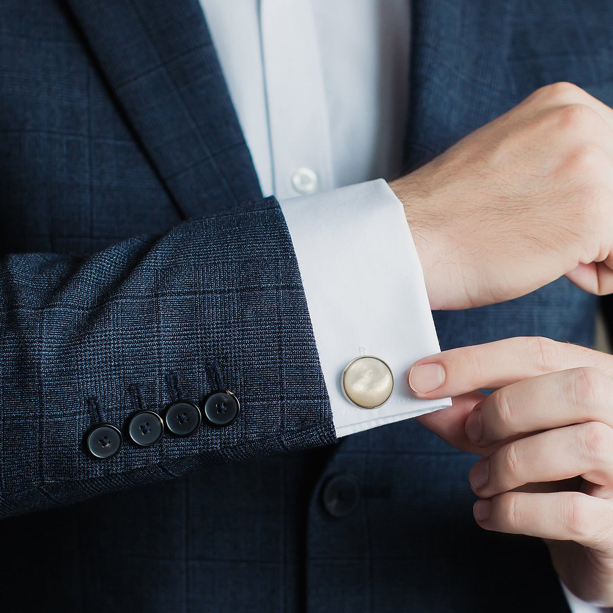 cufflink on mans shirt