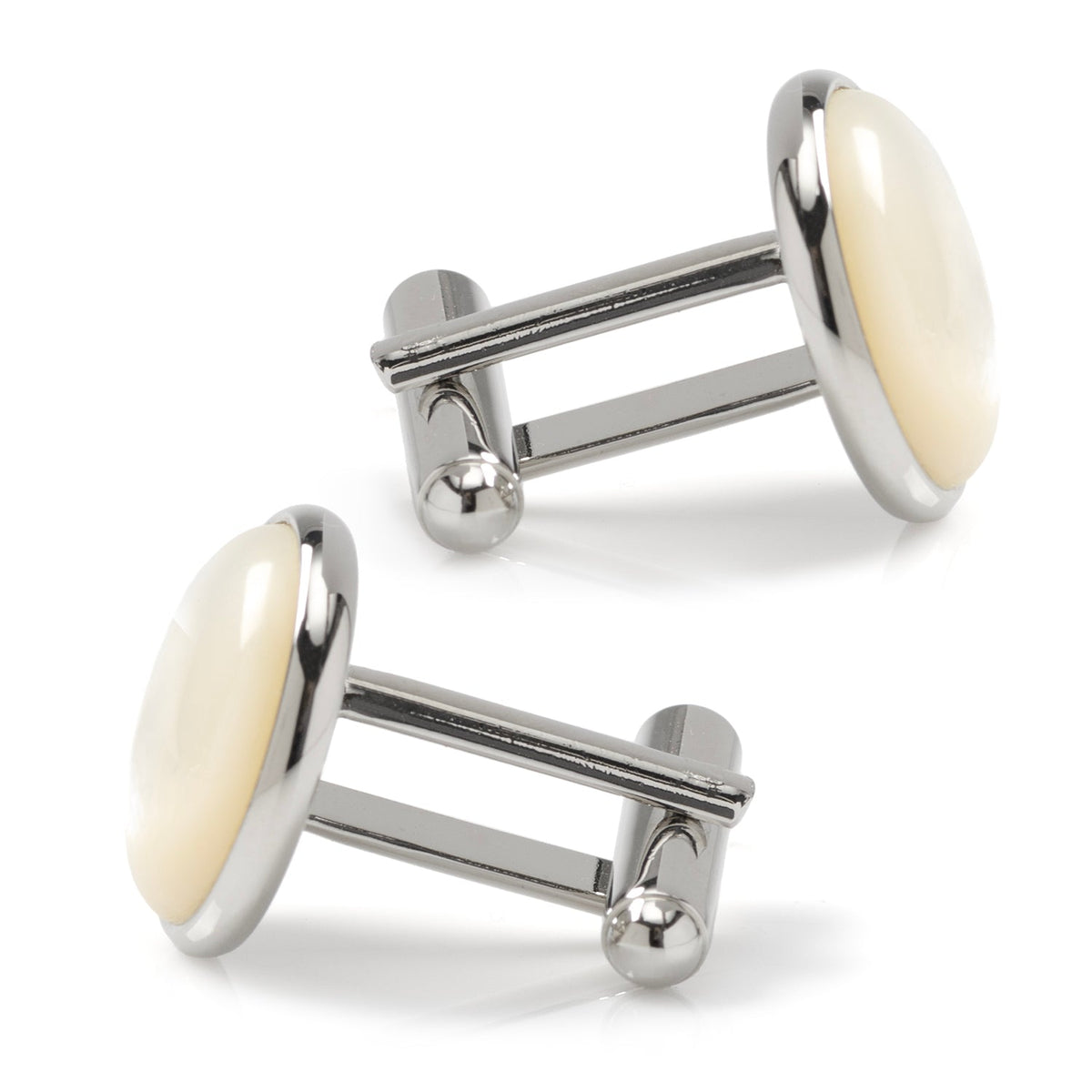 Silver cufflinks with white stones on a white background