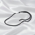 A black twisted rope chain necklace with a lobster clasp, shown against a plain white background.