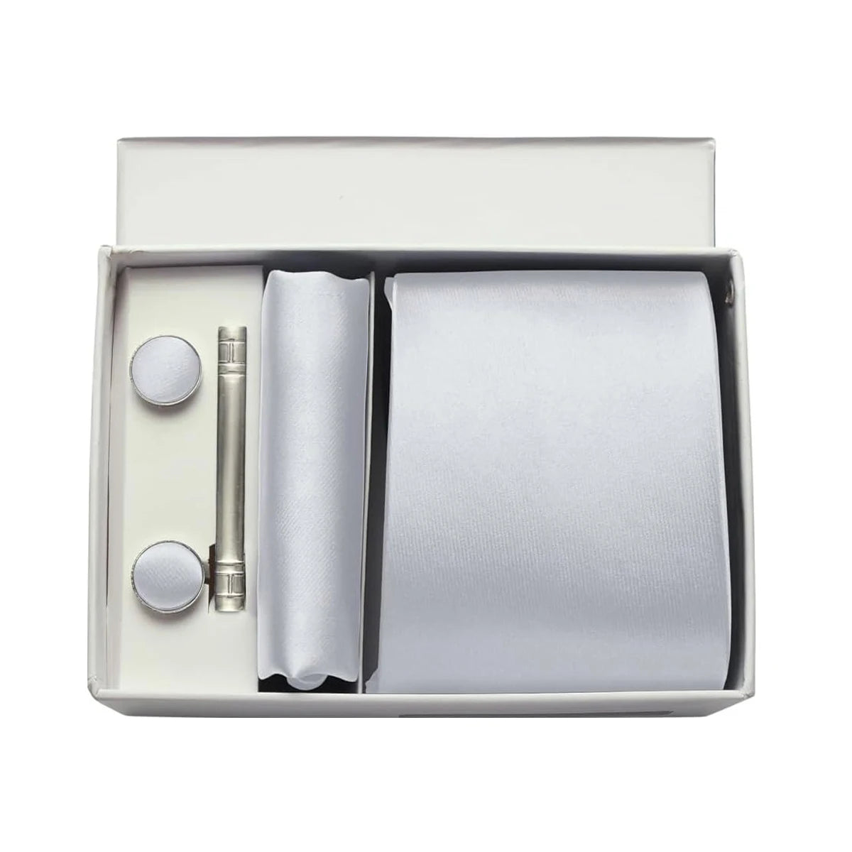 Silver tie set with accessories in a box on a white background