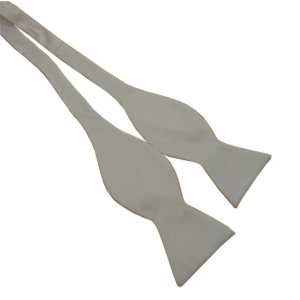 Two light gray fabric bow ties arranged on a plain white background.