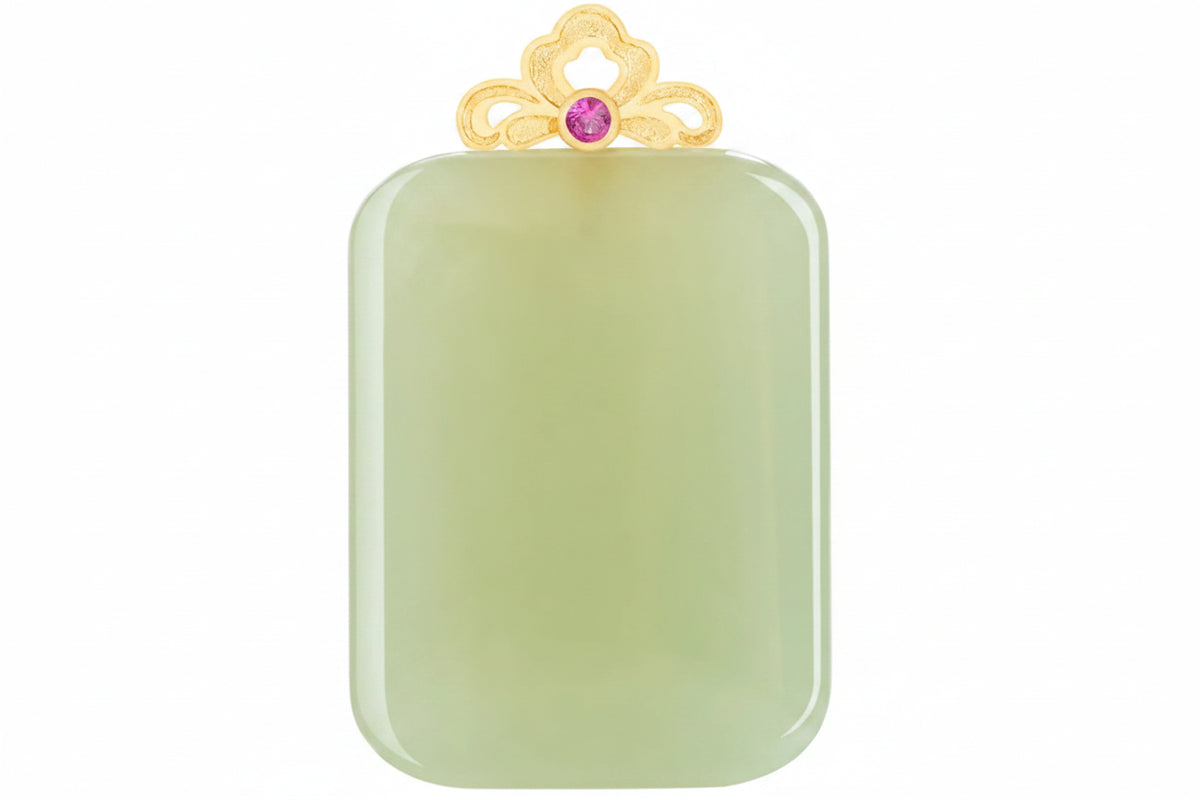 A rectangular jadeite pendant with rounded corners in a pale green hue, featuring a decorative gold filigree crown at the top with a central pink gemstone. The Mengfancy logo is visible in the upper left corner.