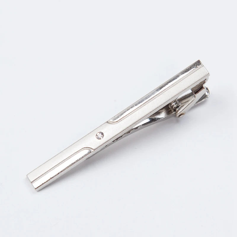 Silver tie clip on a white background