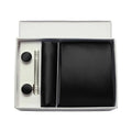 Black tie set with cufflinks and a silver clip in a white box on a white background
