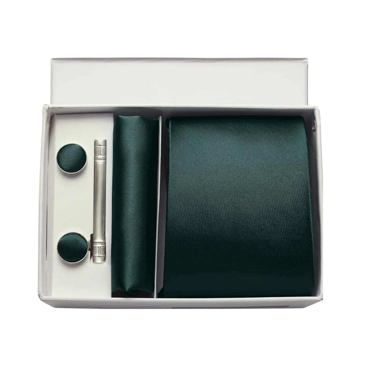 Green tie set with cufflinks and a tie clip in a box on a white background