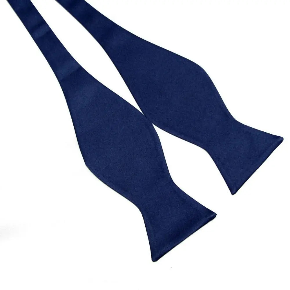 Two blue bow ties on a white background