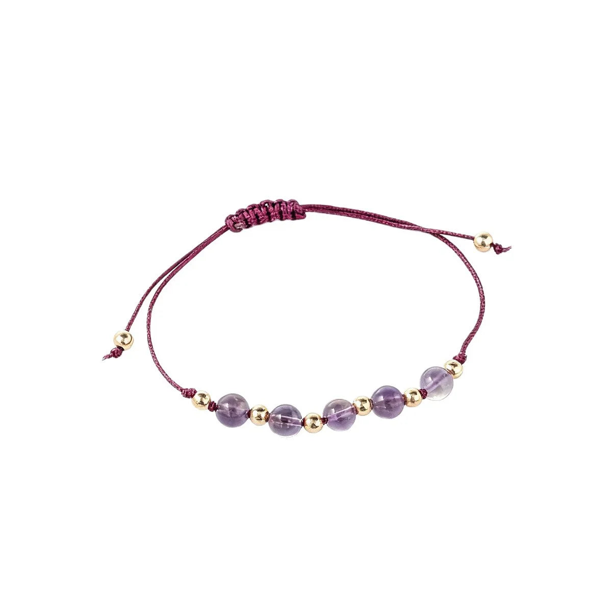 Bracelet with purple beads and gold accents on a white background