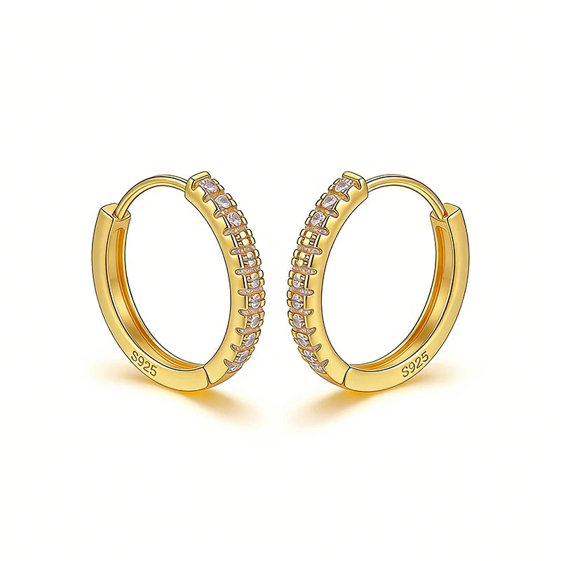 Gold hoop earrings with embedded stones on a white background