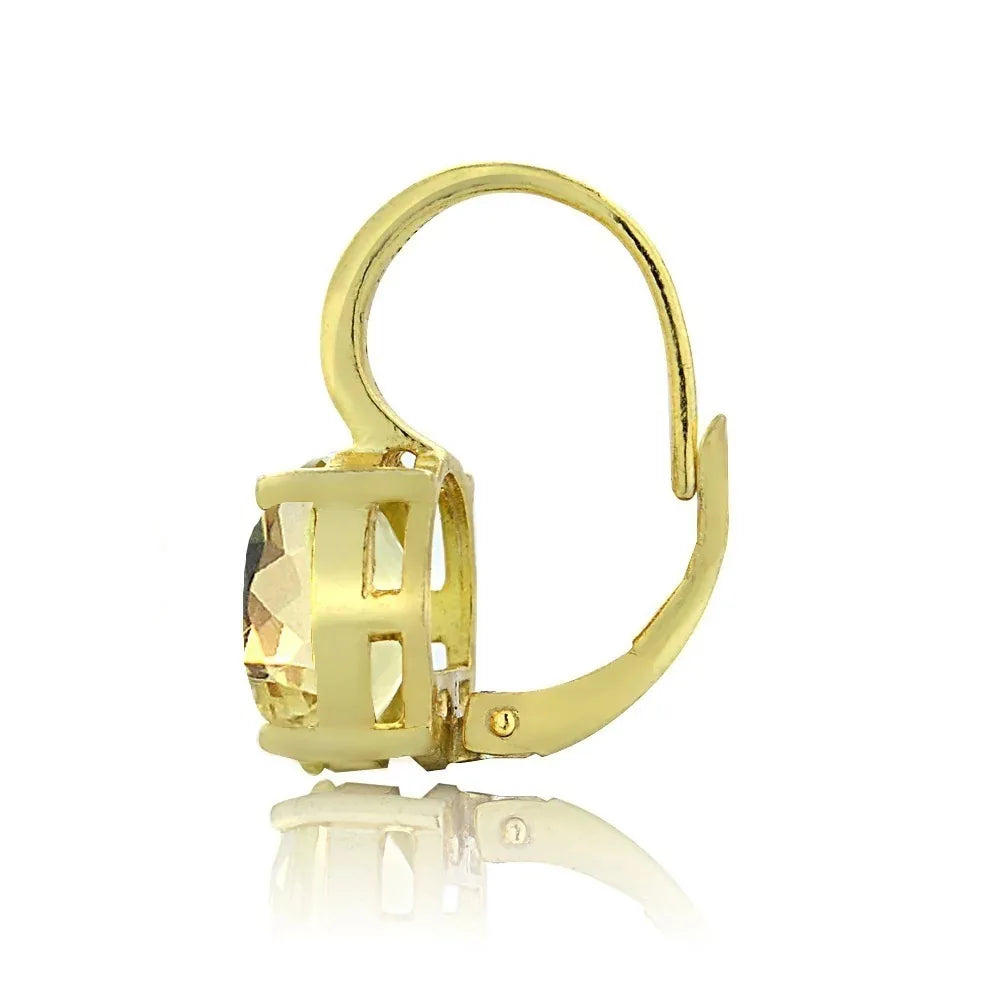 Gold hoop earring with a clear gemstone on a white background
