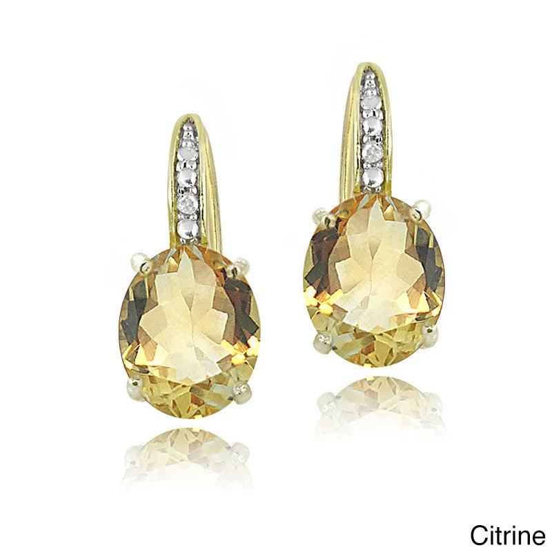 Citrine earrings with gold and silver accents on a white background