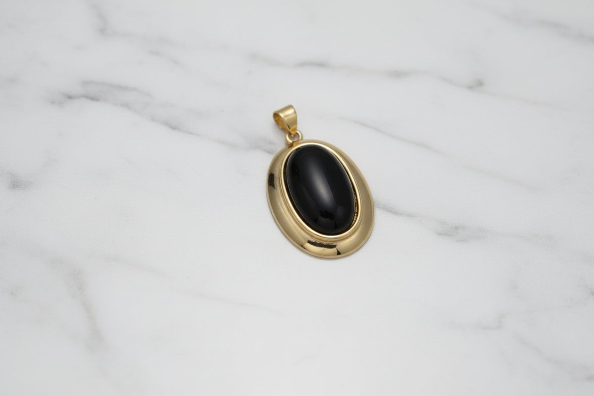 Gold ring with engraved text and a diamond on a white background