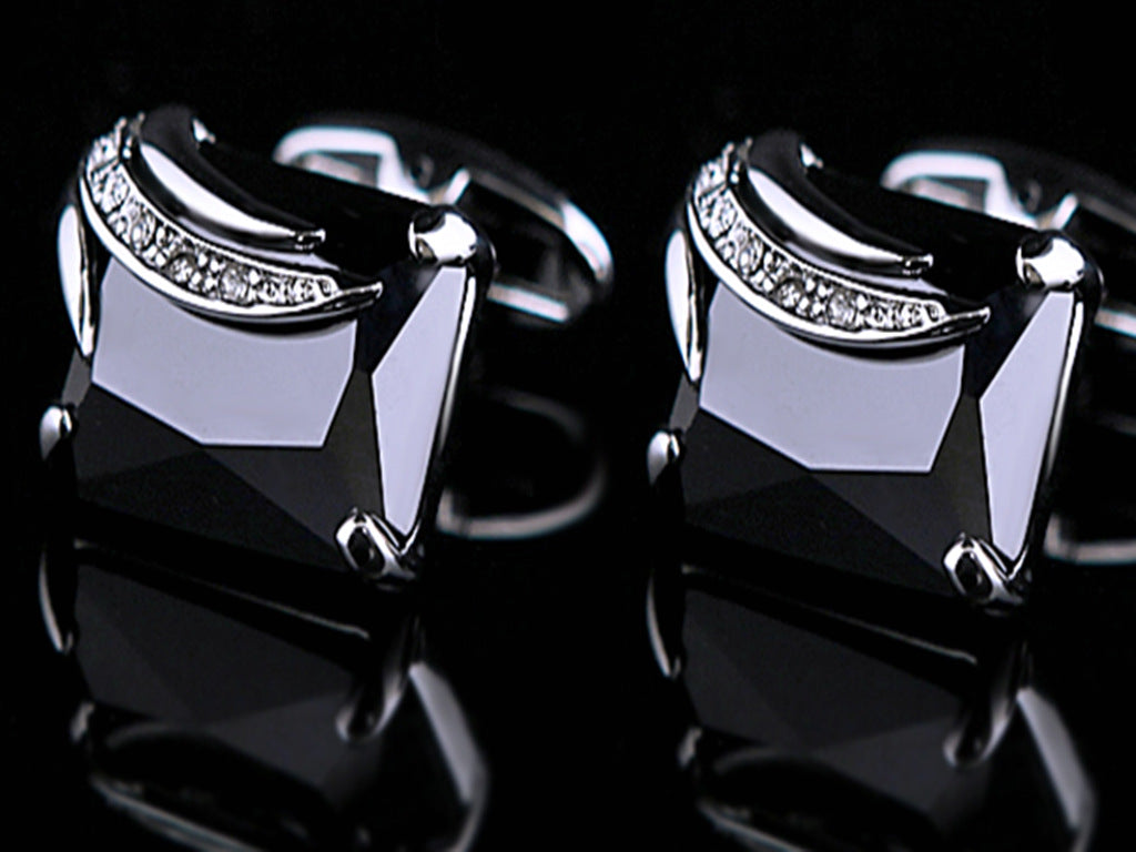 cufflinks on black background